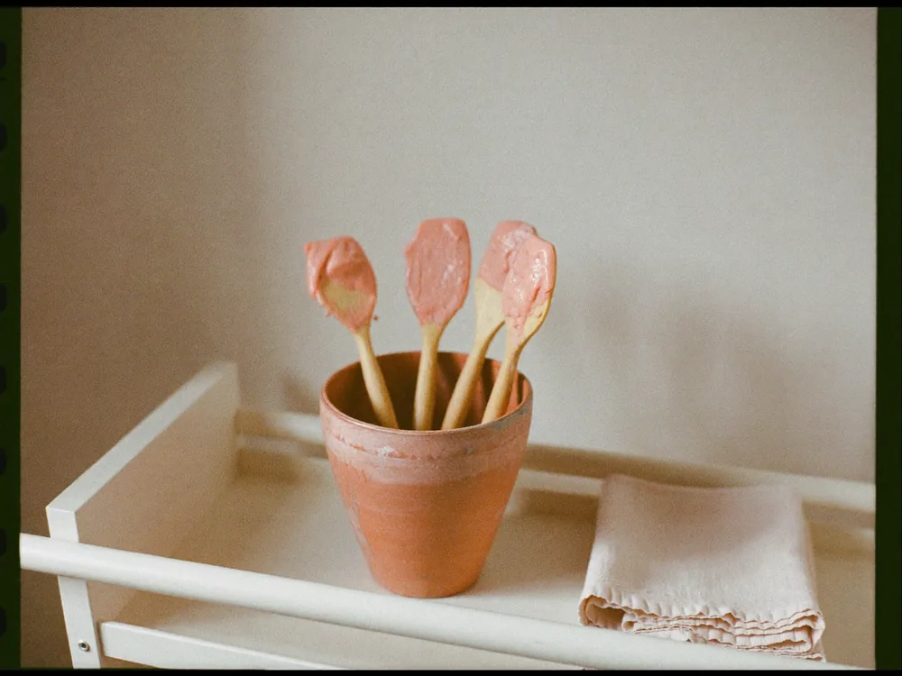 Wooden spatulas in a jar on a clean treatment trolley